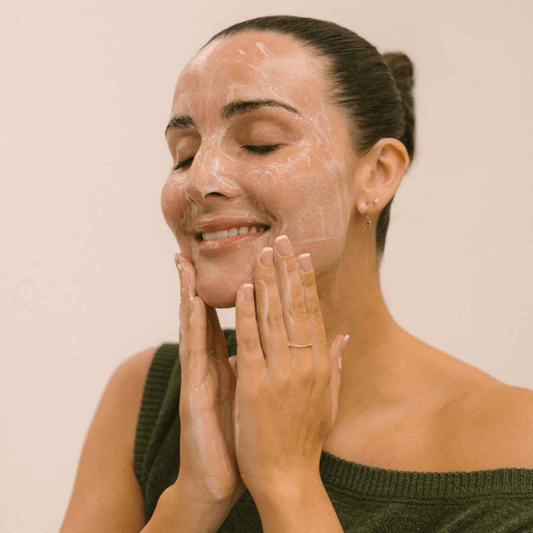 Woman applying Eco by Sonya natural Super Citrus Cleanser